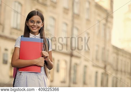 To Succeed You Must Read. Happy Child Hold Books. School Library. Library Reader Smile Outdoors. Rea