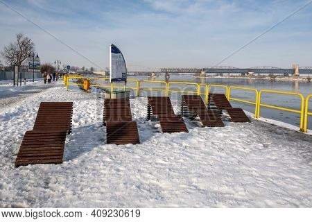 Tczew, Poland - February 21, 2021: Relaxation Zone On The Riverside Promenade In Tczew. The Historic