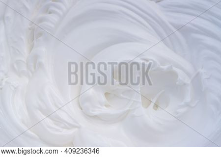 Egg Whites With Suger Added Whipped Into A Meringue In A Bowl