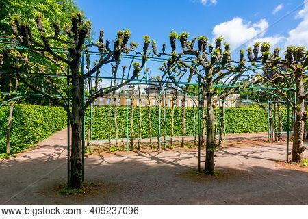 New Chambers (neue Kammern) Palace And Windmill (windmuhle) In  Sanssouci Park In Spring, Potsdam, G