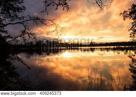 Sunset Over Glebe Creek, Virginia On A Stormy Night
