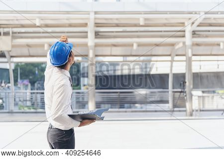 Construction Engineer In Safety Suit Trust Team Holding White Yellow Safety Hard Hat Security Equipm