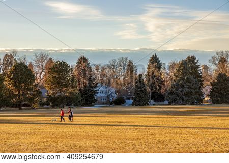 Denver, Colorado - February 19, 2021: People Enjoying A Beautiful Sunset In Cranmer Park, Denver, Co