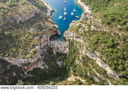 Aerial Drone Shot Of Iconic Stiniva Cove Beach Of Adriatic Sea On Vis Island In Croatia Summer
