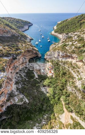 Aerial Drone Shot Of Iconic Stiniva Cove Beach Of Adriatic Sea On Vis Island In Croatia Summer