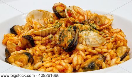 Delicious Seafood Risotto, Risotto Ai Frutti Di Mare, On White Dish. Close-up