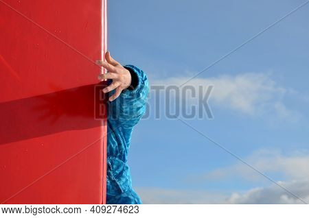 The Child Hits The Foam Barrier At High Speed On A Pole Near The Ski Slope. Safety Protection Of An 