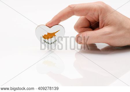 Cyprus Flag. Love And Respect Cyprus. A Man's Hand Holds A Heart In The Shape Of The Cyprus Flag On 