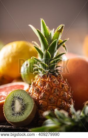 Exotic Fruit Such As Pineapple, Kiwi And Citruses In A Detail.