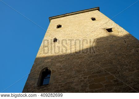 Medieval tower, known as the prison tower or clock tower, in the city of Jaca, Pyrenees, Huesca province, Aragon in Spain.