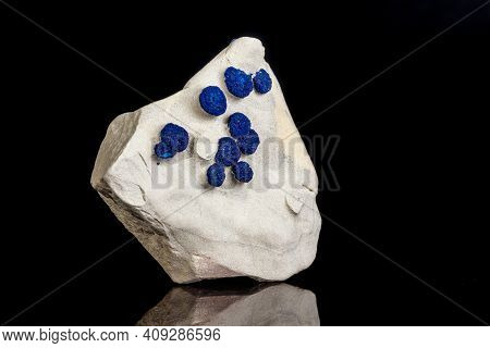 Macro Mineral Stone Azurite In Siltstone Against Black Background