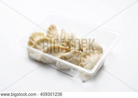 Traditional Pierogi, Dumplings On A Plastic, Transparent Food Tray, Isolated On A White Background. 