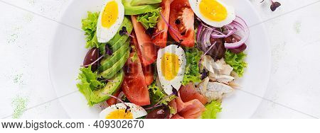 Ketogenic Diet Breakfast. Salt Salmon And Baked Dorado Salad With Greens, Tomatoes, Eggs And Avocado