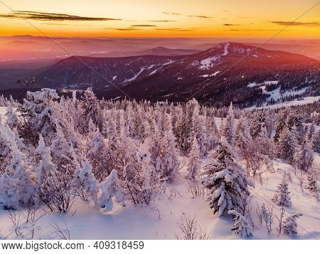 Colorful Winter Sunset In Sheregesh Ski Resort Mountains Covered Trees. Aerial Top View Beautiful Fo