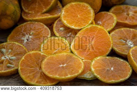 Close-up Of Fresh Orange Fruits On The Old Wooden Table. Tangerine Phurua Species, Juicy Orange Sour