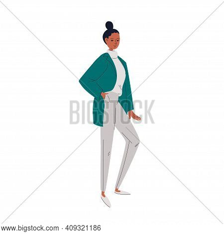 A Pretty Young Woman In An Emerald Jacket And Gray Sweater And Pants. The Girl Holds Her Hand In Her