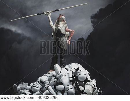 FEB 20 2021: Star Wars humor, Jar Jar Binks on top of a pile of defeated Stromtroopers - Hasbro action figure