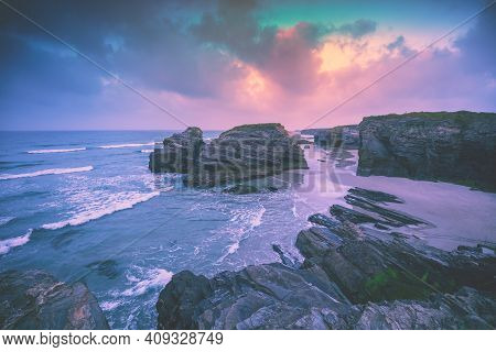 Rocky Sea Coast At Sunrise. Beach Playa De Las Catedrales. Praia De Augas Santas. Ribadeo, Spain