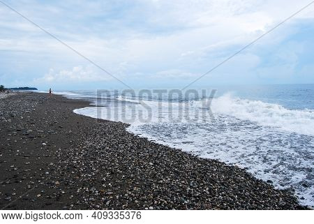 Waves On The Seashore. Frothy Waves. Clouds Over The Coast. The Sea Is Stormy.