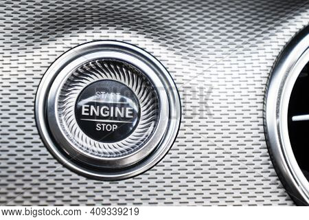 Car Dashboard With Focus On Engine Start Stop Button. Modern Car Interior Details. Start/stop Button