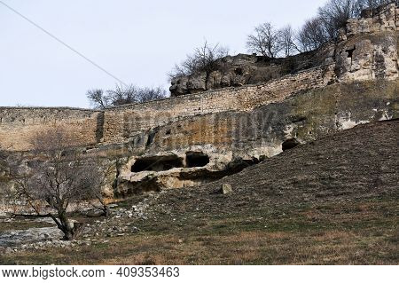 View Of The Ruins Of A Medieval Cave City-fortress On A Rocky Hilltop