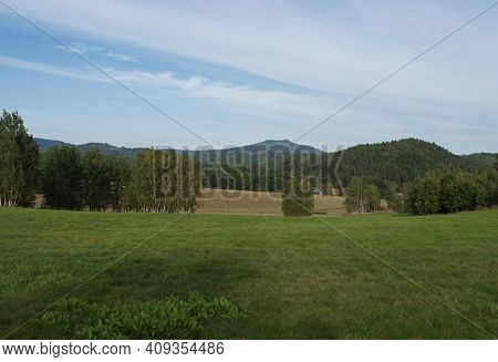 Meadow With Forest, Fields And Hills With Summer Sunny Day, Landscape In Luzicke Hory Lusatian Mount