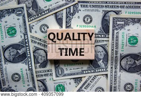 Quality Time Symbol. Wooden Blocks With Words 'quality Time'. Beautiful Background From Dollar Bills