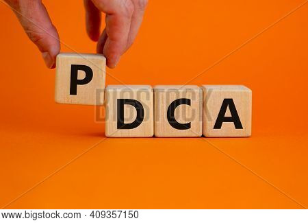 Pdca, Plan Do Check Act Symbol. Wooden Cubes With Words 'pdca, Plan Do Check Act'. Beautiful Orange 