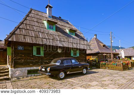 DRVENGRAD, SERBIA - SEPTEMBER 03: Retro cars in traditional village Drvengrad Mecavnik on September 03, 2015 in Drvengrad, Serbia.