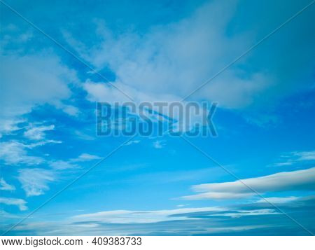 Wid Blue Sky,colorful Stratus Clouds Stretching Away On Beautiful Bright Sunny Day, Evening.horizont
