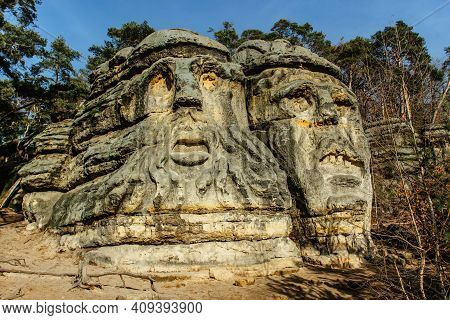 Two Giant Heads Of Devils Carved Into Sandstone Rocks,each Is About 9m High.devils Heads Created By 