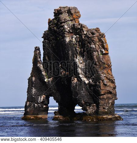 A Large Rock Formation In The Sea
