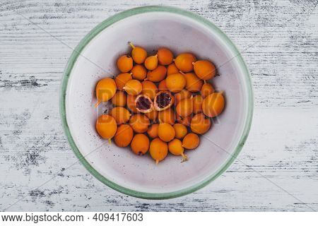 Bluecrown Passion Fruits In Fruit Bowl With One Cut In Half To Show The Seeds Inside, Simple Food In