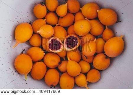 Bluecrown Passion Fruits In Fruit Bowl With One Cut In Half To Show The Seeds Inside, Simple Food In