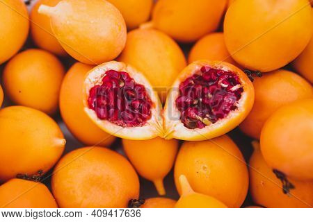 Bluecrown Passion Fruits In Fruit Bowl With One Cut In Half To Show The Seeds Inside, Simple Food In