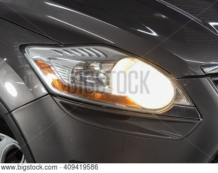 Novosibirsk, Russia - February 18 2021: Ford Kuga, Headlight Of A Modern Popular Car Close-up. Shiny
