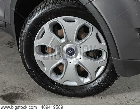 Novosibirsk, Russia - February 18 2021: Ford Kuga, Car Wheel On Gray  Car - Close Up