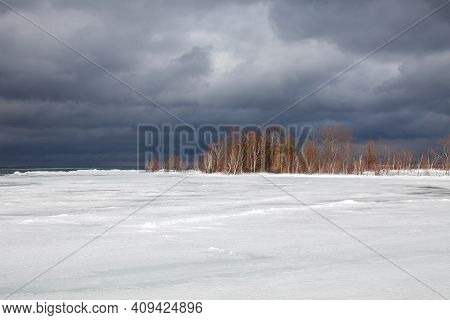 A Winter Storm Approaches The Shores Of Southern Georgian Bay In Lighthouse Point, Collingwood. Ice 