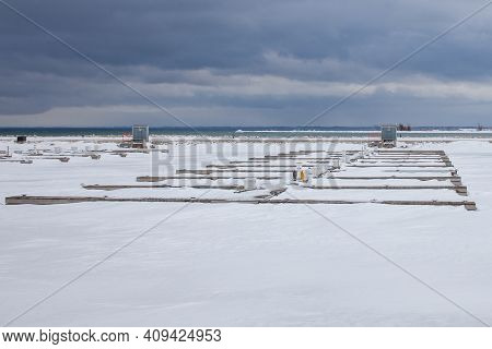 Boat Slips Are Frozen In While The Lighthouse Point Marina In Collingwood, Ontario, Experiences Wint