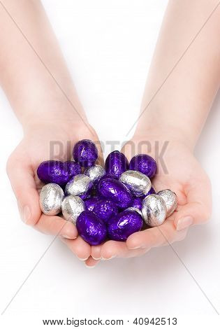 Puple And Silver Easter Eggs In Hands