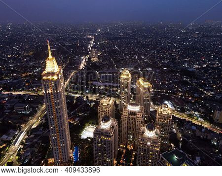 Pakubuwono Skyline Aerial Drone View From Above At Night, Jakarta Downtown Skyscrapers Cityscape And