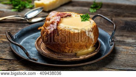 Delicious Cream Soup With Bacon Serve In Bread On Table. Diet Fresh Food Meal Dish Soup Lunch On A R