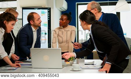 International Business Team Talking To African Woman Mentor Discussing Company Development Plan Stan