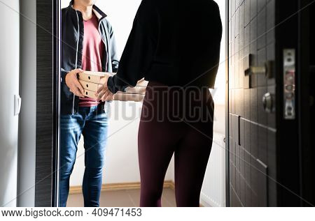 Delivery Pizza To Door. Restaurant Deliver Food Home. Courier Giving Boxes To Happy Young Woman. Del