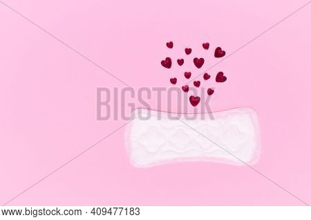 Daily Hygienic Women's Pad And Hearts. Critical Days Concept.