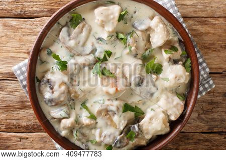 Ciulama De Pui Is A Romanian Creamed Chicken Dish With Mushrooms Closeup In The Bowl On The Table. H