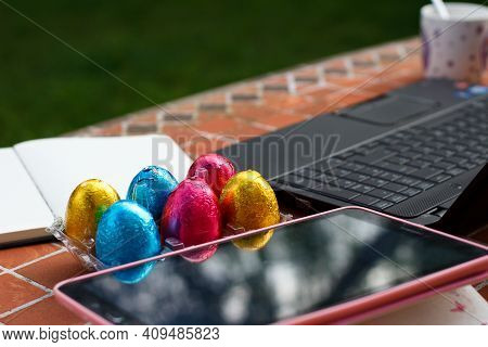 Colored Eggs For Easter Together With Computer And Tablet, Preparing Interactive Games