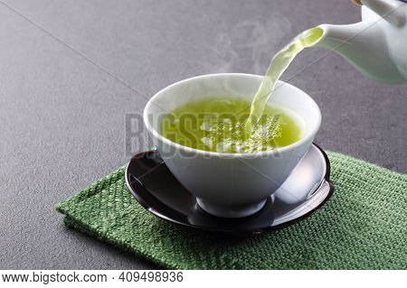 Masala Tea. A Cup Of Traditional Indian Tea Masala Tea With Ingredients To Prepare. Cinnamon, Anise,