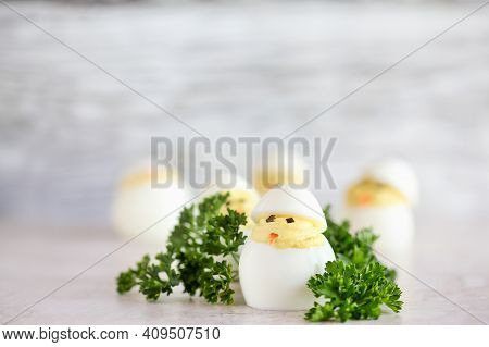Deviled Eggs For Easter Decorated As Cute Little Chicks Hatching From Eggs With Carrot Beak And Seaw