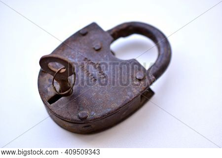Old Curtain Padlock On A White Background